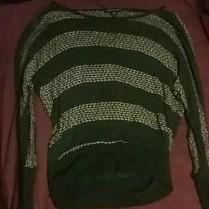 A long sleeved black and tan sweater